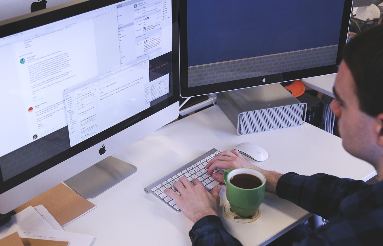 Typing, computer, man — Boost Your Construction Business with Contractor Foreman: Affordable and Efficient