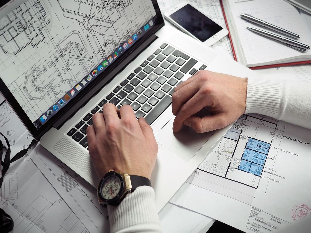 Blueprints, entrepreneur, hands — High-Quality Moulding for Easy Installation and Long-Lasting Aesthetic Appeal